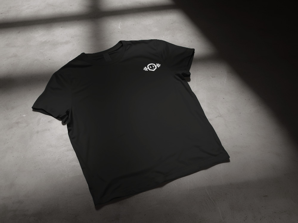 Ein T-Shirt Mockup, welches auf dem Boden liegt. Auf dem T-Shirt im brustbereich ist das Bildzeichen.